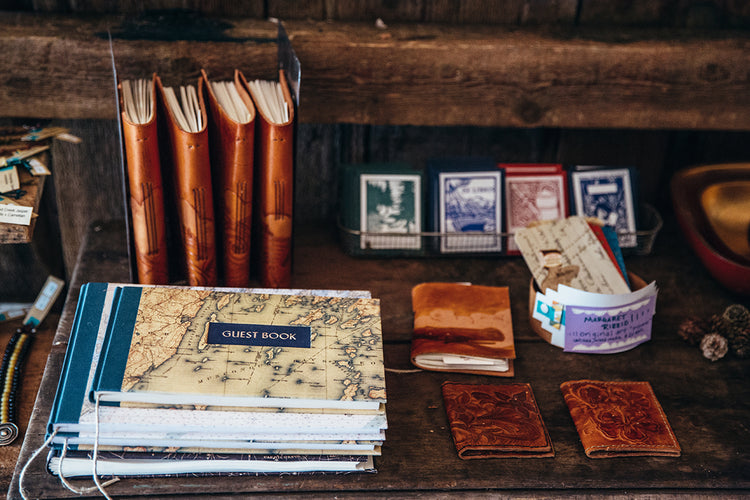 An old open book with blank pages on an old wooden table in a sp