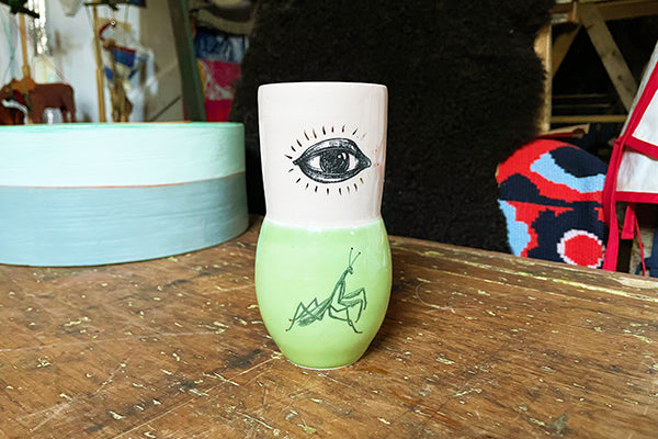 Gold Lustered Ceramic Vase with Praying Mantis and Eye by Luster Hustler Aidan Fraser Female Form Midcoast Maine Artisan Store The Good Supply Pemaquid Made in USA
